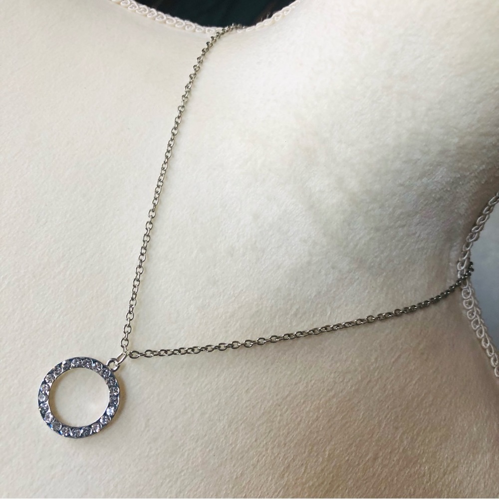 Clear rhinestone ring pendant on chain necklace